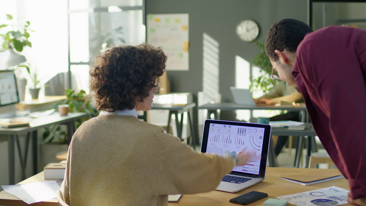 Timelapse of Female Financial Analyst Working in Office