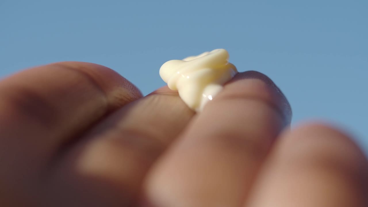 Applying Sunscreen Cream