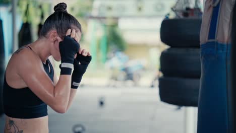 woman training muay thai in a gym