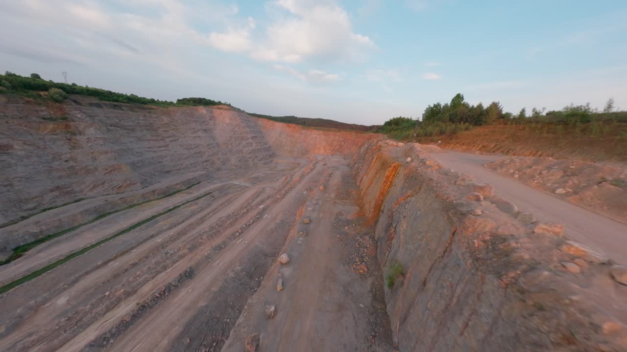 Exposed quarry walls in limestone mine, aerial mining view