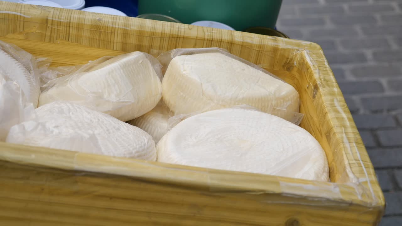 White Cheese in Wooden Box at a Market