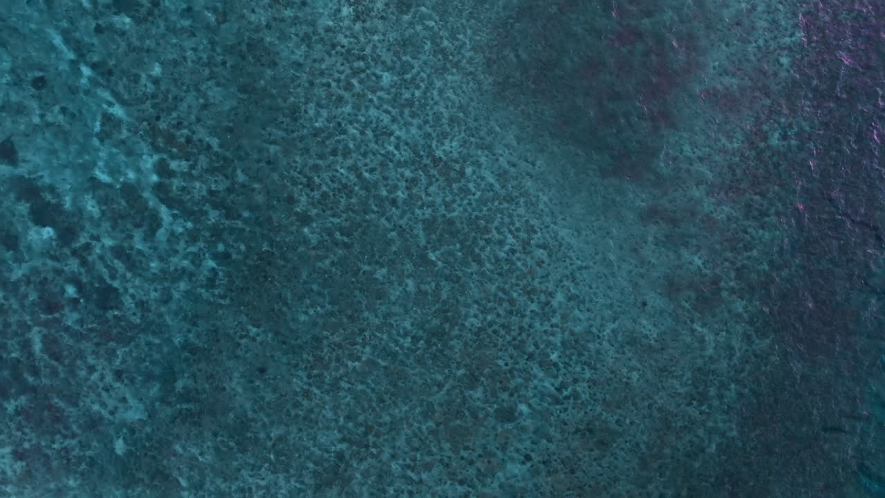 Slow zoom panoramic shot of coral reef in Okinawa, Japan