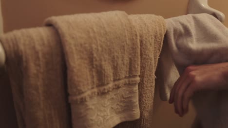 hands being dried with a hand towel