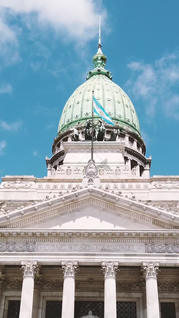 Green dome, Argentine flag waves over national Congress at Buenos Aires city Sky Government building, Vertical view