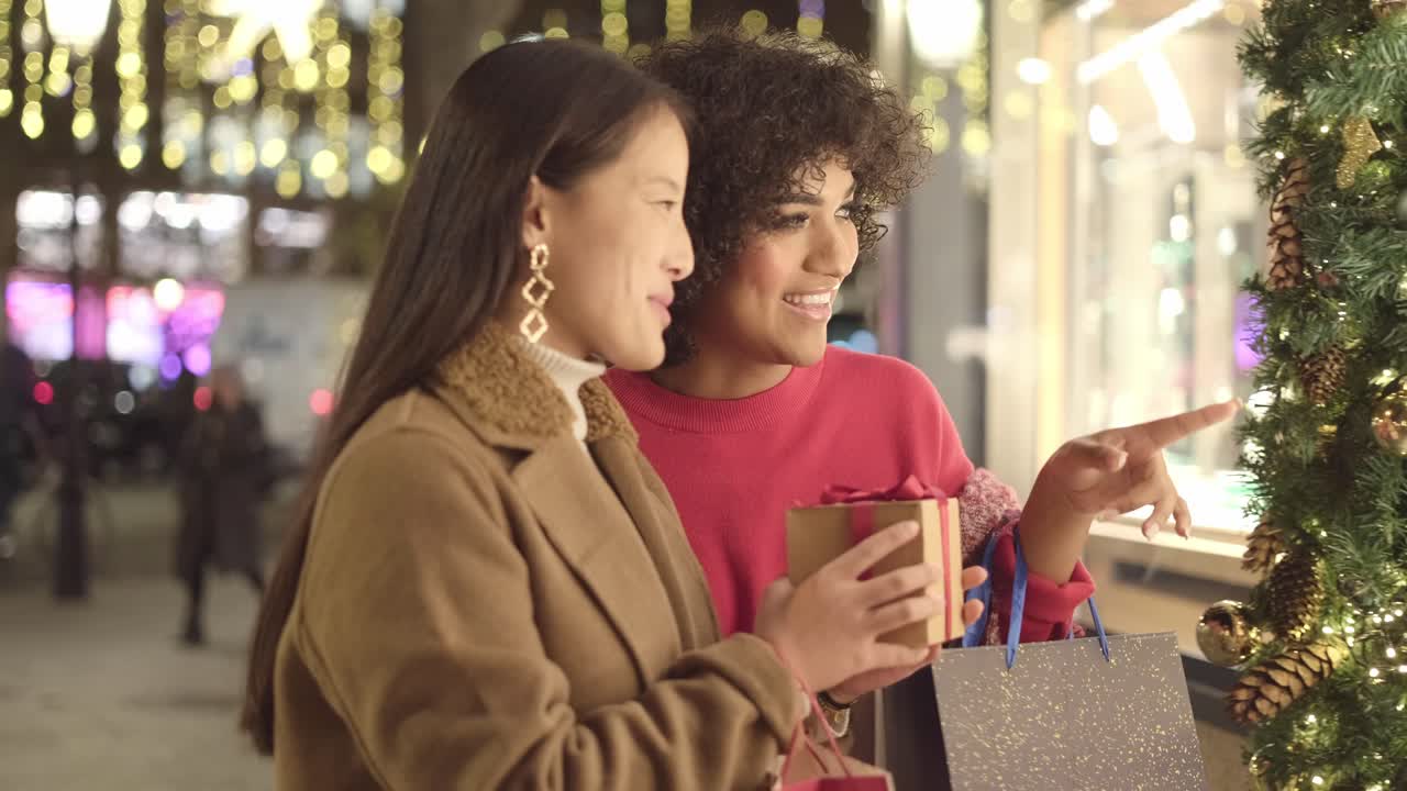 Two Women Christmas Shopping at Night