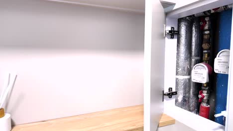 A-modern-bathroom-with-hidden-water-meters,-an-ingenious-solution