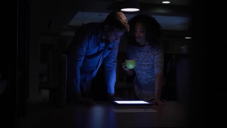 young office executives working over digital tablet in a modern office