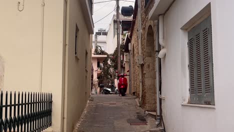 narrow street in chersonissos old town with bikes in view