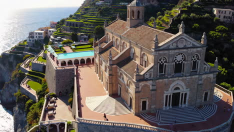 stunning aerial view of a coastal church in italy