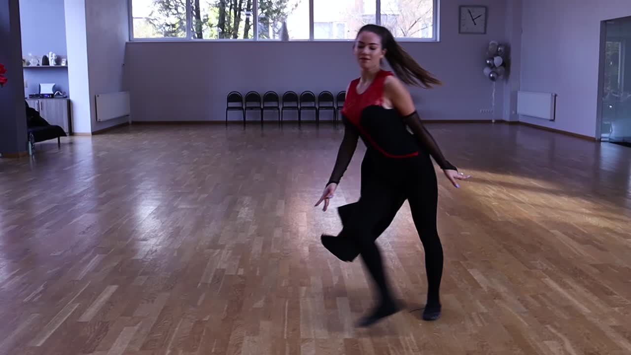 Slow motion professional and passionate female dancer does a flip over on her hands