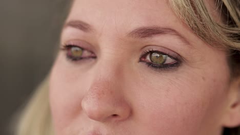 cropped studio shot of stunning beautiful green eyes of mature woman