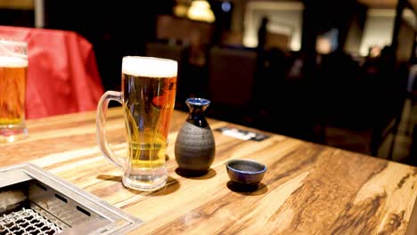 spinning top circling around a beer glass