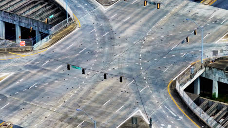 driving cars turning at large junction in american city st sunny day