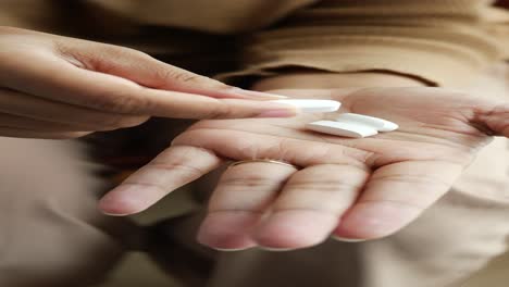 woman taking pills