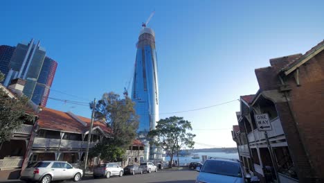 skyscraper under construction on quiet street