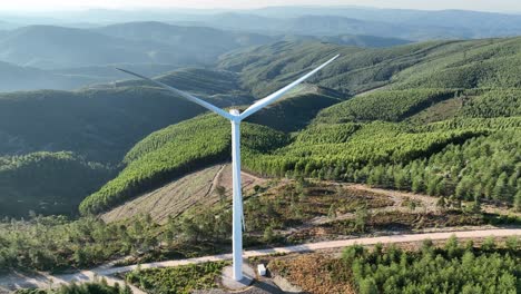 Slowly-flying-back-footage-of-a-wind-turbine