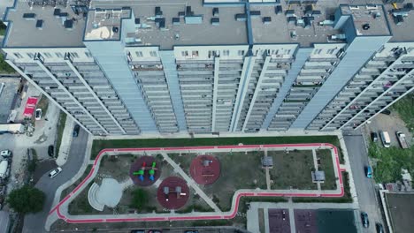 Aerial-view-of-a-high-rise-residential-complex-with-well-designed-landscaping-and-amenities,-highlighting-urban-living-in-a-modern-city