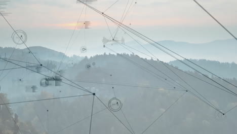 animated digital network overlaying misty mountain ridges, showing lines, nodes and waveform charts