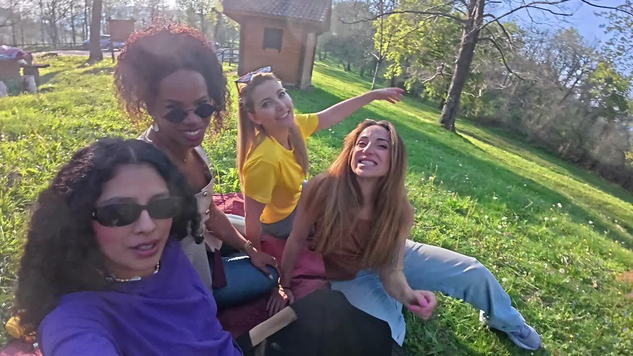 A group of friends enjoying a picnic outdoors