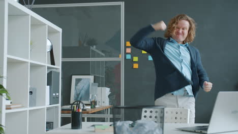 happy employee dancing in office
