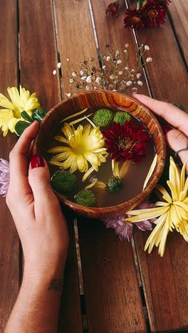 floral arrangement in wooden bowl