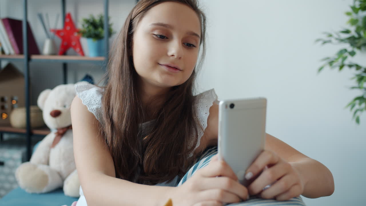Teenage Girl Using Smartphone/Tablet
