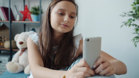 teenage girl using smartphone/tablet