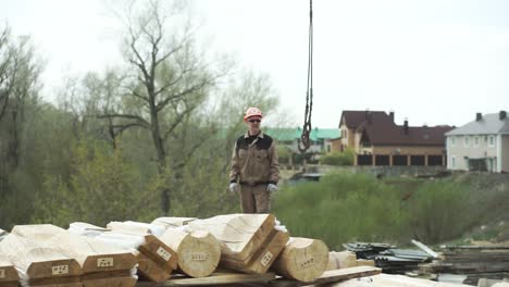 construction of a log house with a crane