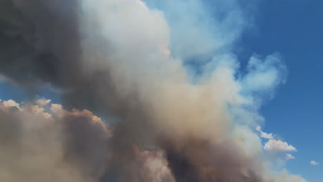 dark smoke rising from destructive and dangerous wildfire fairview fire burning on distant hills, hemet, california, usa