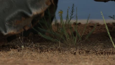 Close-up-view-of-tractor-plowing-the-farm