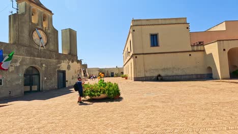 exploring a historic castle courtyard in naples