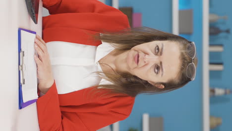 Vertical-video-of-Home-office-worker-woman-stressed-and-thoughtful.