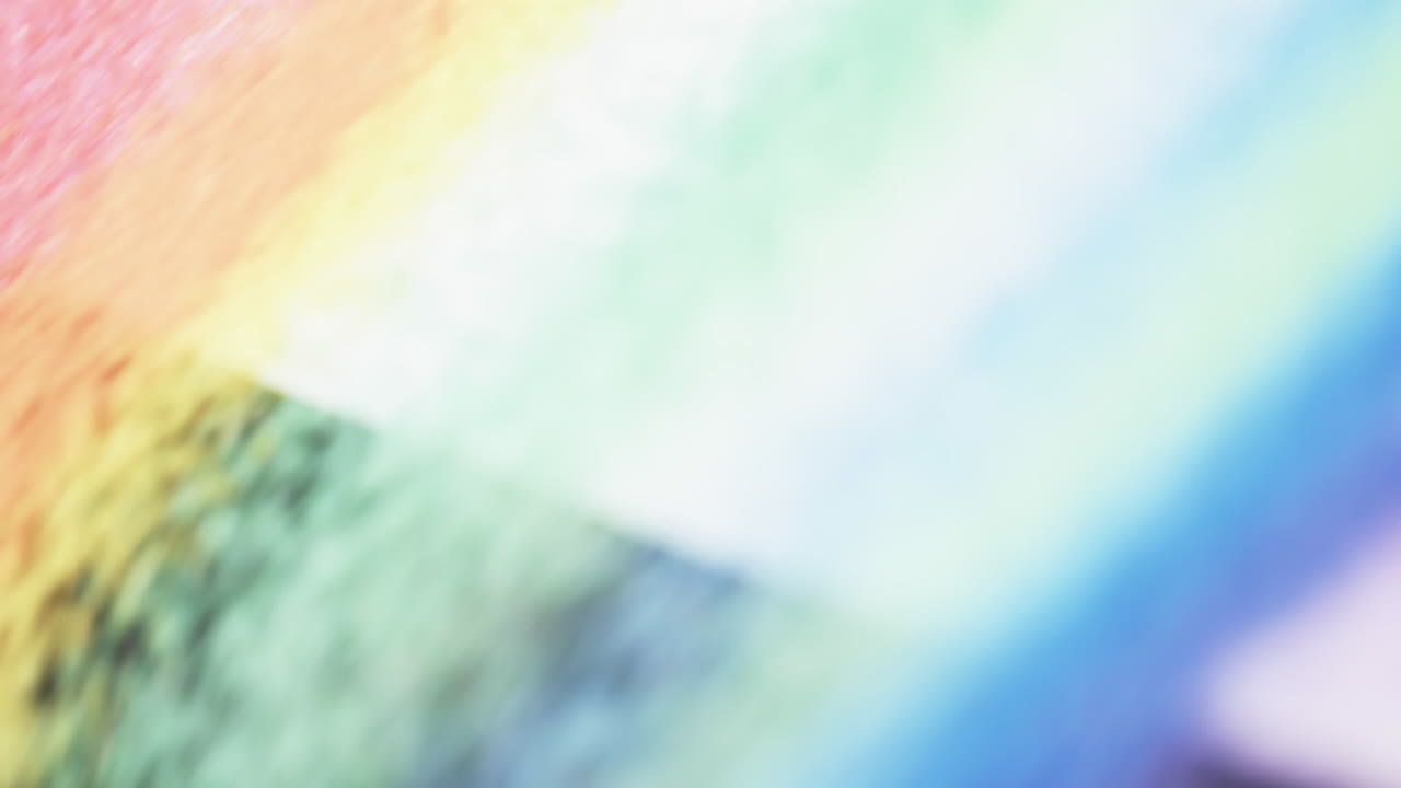 무지개 색의 모래 알 ⁇ 이와 복사 공간 배경의 클로즈업 비디오