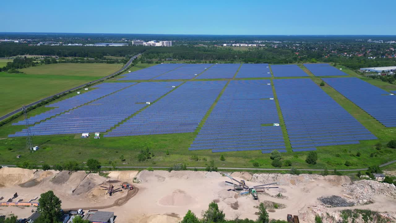large solar farm in Germany, providing clean and sustainable energy. Lovely aerial view flight fly reverse drone