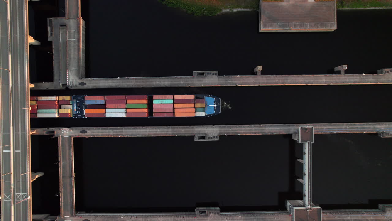 Aerial View of a Container Ship Passing Through a Lock