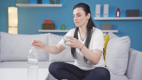 The-sick-woman-drinks-a-lot-of-water.