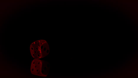 dice being thrown with red light on black background