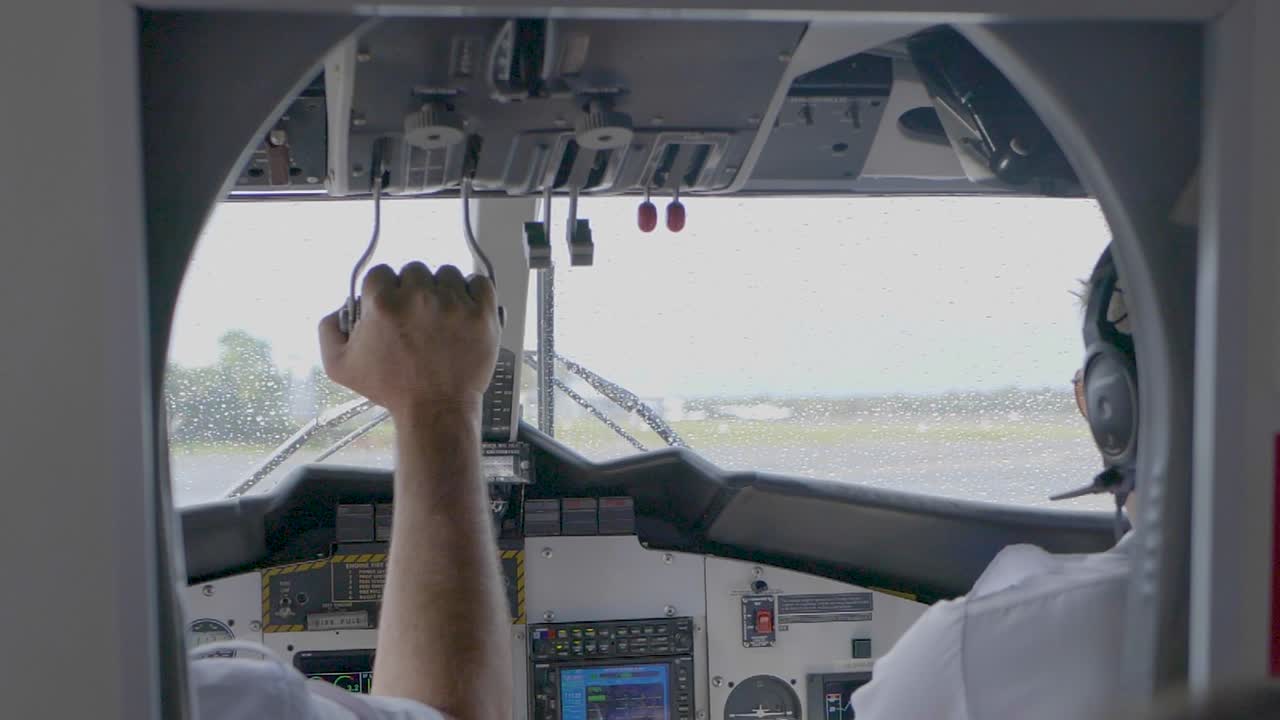 Pilot flying airplane in the rain