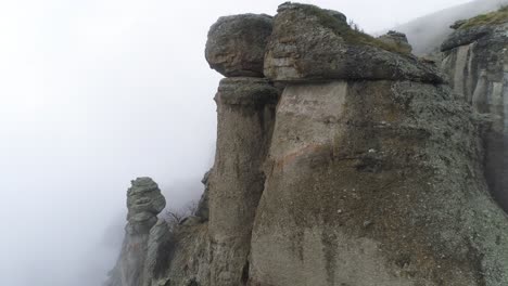 misty mountain peaks with rock formations