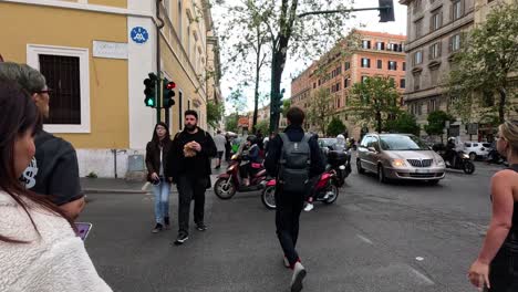 pedestrians and vehicles at a busy intersection