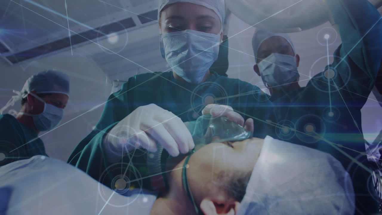 Animazione di una rete di connessioni e scie luminose sopra medici e un paziente.