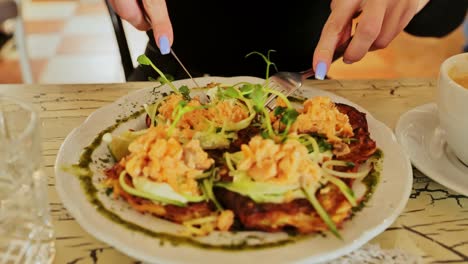 woman enjoying rustic latvian-style pancakes with creamy and crispy textures