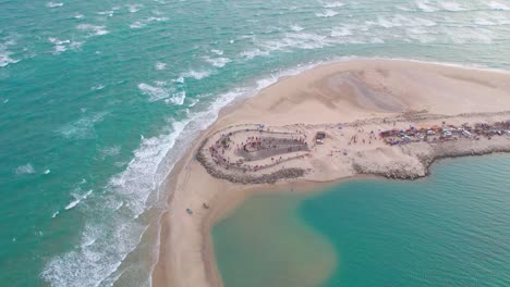 aerial drone view of idyllic hawaiian beach, surrounded by vast turquoise ocean, with the pristine shoreline and shimmering waters stretching out in all directions