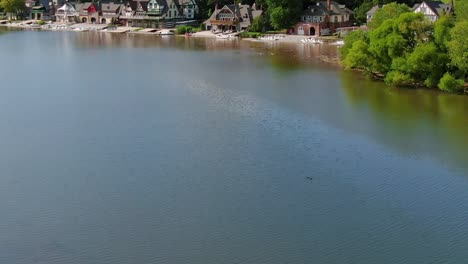 the fairmont dam in schuylkill rowing basin reservoir with the scenic riverside site of historic boathouses for rowing clubs