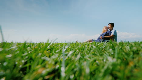 Multi-Ethnic-Couple-Resting-On-The-Green-Grass-Admiring-The-Beautiful-Nature