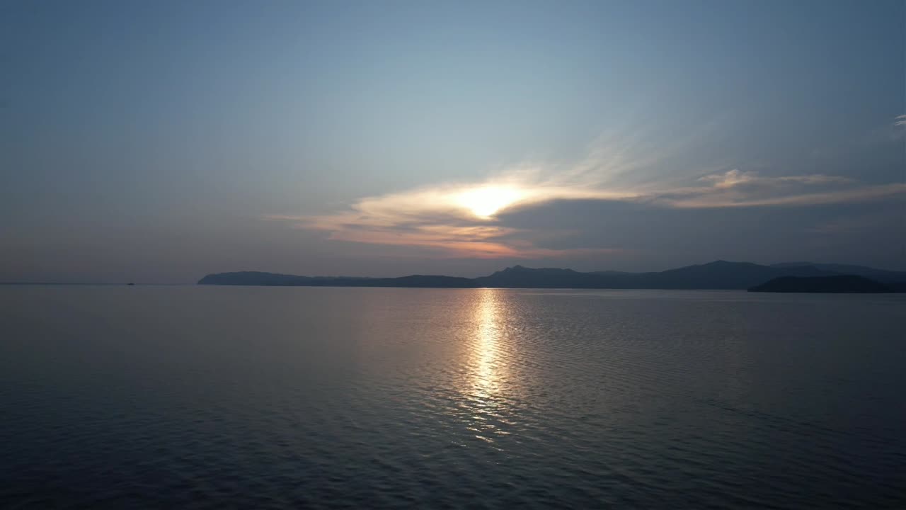 Flying towards sunset from Mission Island in Raja Ampat, Indonesia