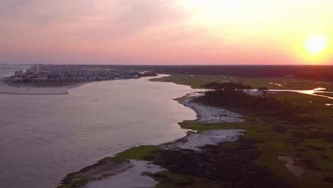 north myrtle beach at sunset with marsh and ocean inlet