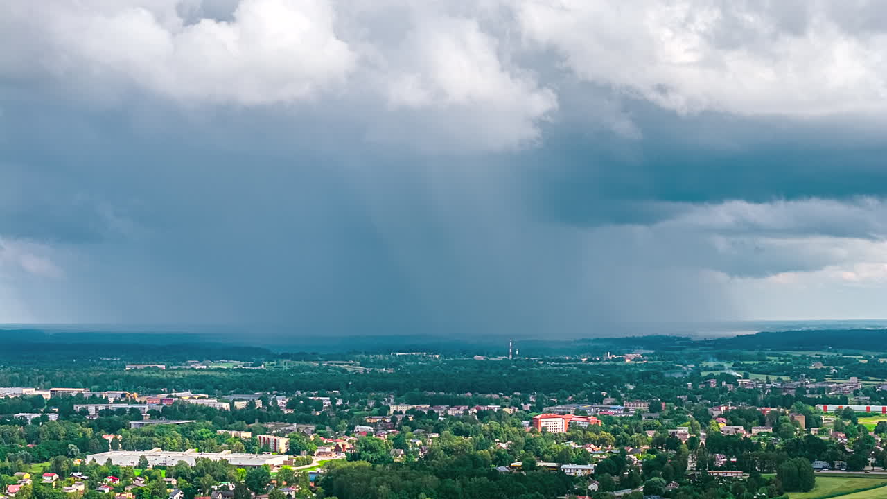 Dark Stormy Clouds Are Moving Over The City With Dense Nature. Timelapse