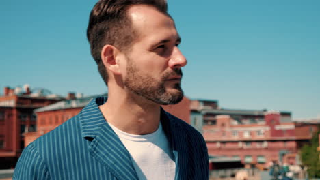 man in a blue striped jacket outdoors