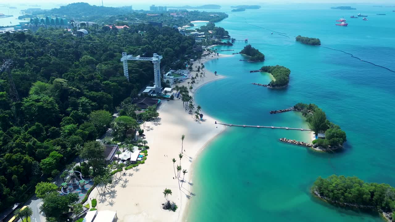 Aerial drone landscape of Sentosa Island Siloso harbour beachfront cable car sandy ocean bungee jump Singapore recreation Asia travel tourism